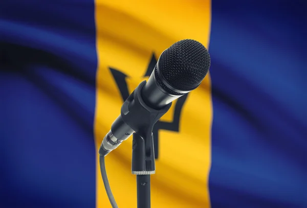 Мікрофон на стенді з національного прапора на фоні - Барбадос — стокове фото