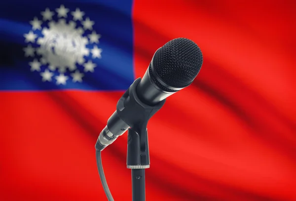 Microphone on stand with national flag on background - Burma — Stock Photo, Image