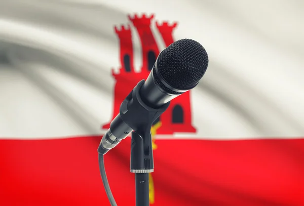 Microphone on stand with national flag on background - Gibraltar — Stock Photo, Image
