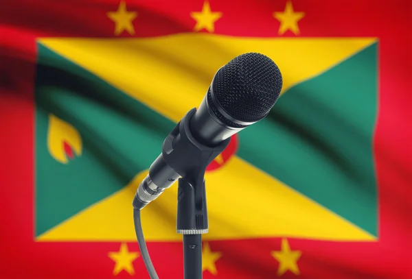 Microphone on stand with national flag on background - Grenada — Stock Photo, Image