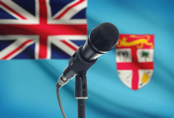 Microphone on stand with national flag on background - Fiji — Stock Photo, Image