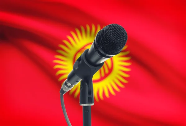 Microphone on stand with national flag on background - Kyrgyzstan — Stock Photo, Image