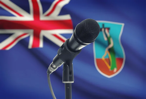 Microphone on stand with national flag on background - Montserrat — Stock Photo, Image