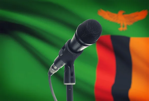 Micrófono en pedestal con bandera nacional de fondo - Zambia —  Fotos de Stock