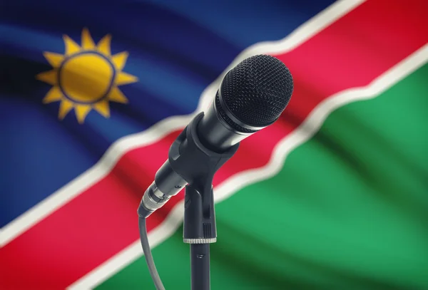 Micrófono en pedestal con bandera nacional de fondo - Namibia — Foto de Stock