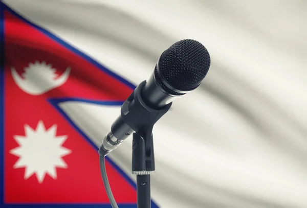 Microphone on stand with national flag on background - Nepal — Stock Photo, Image