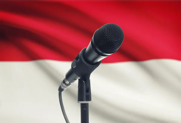 Microphone on stand with national flag on background - Indonesia — Stock Photo, Image