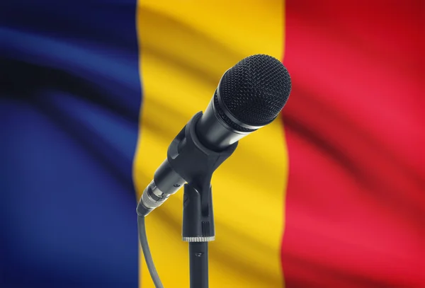 Microphone on stand with national flag on background - Romania — Stock Photo, Image