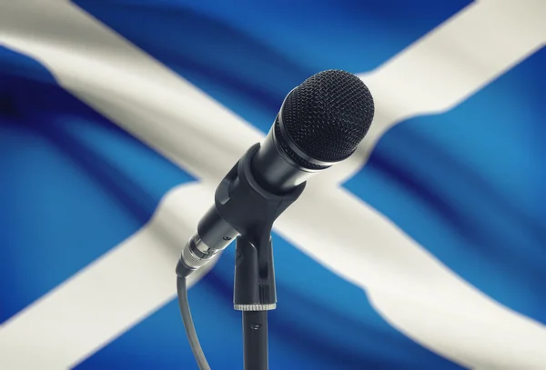 Microphone on stand with national flag on background - Scotland — Stock Photo, Image