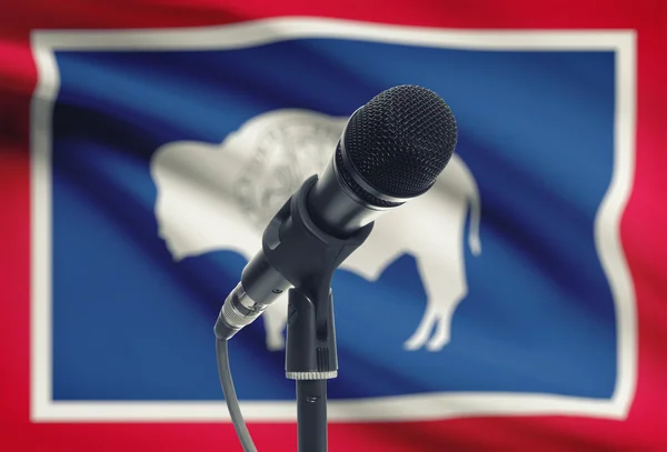 Microphone on stand with US state flag on background - Wyoming — Stock Photo, Image