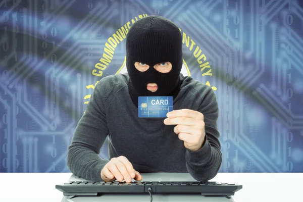 Hacker holding credit card and USA state flag on background - Kentucky — Stock Photo, Image