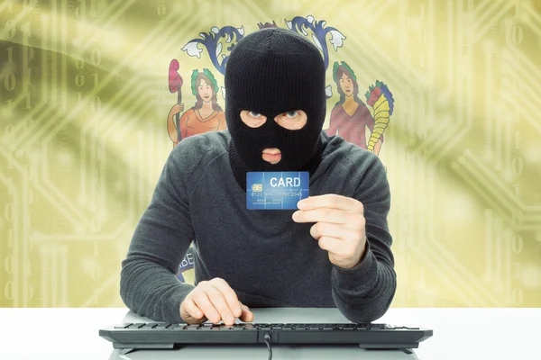 Hacker, tenant de la carte de crédit et drapeau Usa sur fond - New Jersey — Photo