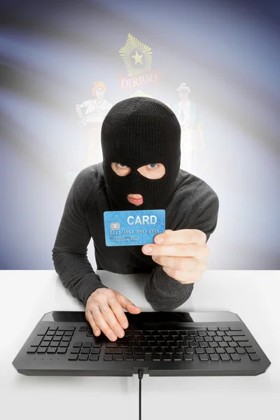 Hacker holding credit card with US state flag on background - Maine — Stockfoto