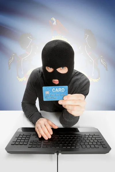 Hacker holding credit card with US state flag on background - Pennsylvania — Stok fotoğraf