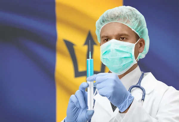 Médico con jeringa en las manos y la bandera en la serie de fondo - Barbados —  Fotos de Stock