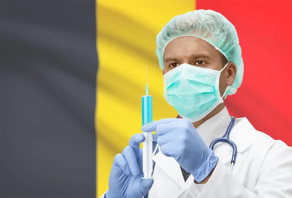 Doctor with syringe in hands and flag on background series - Belgium — Stock Photo, Image