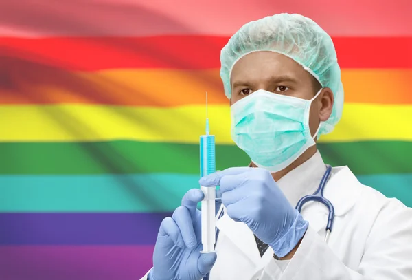 Doktor el ve bayrak arka plan serisi - Lgbt insanlar şırınga — Stok fotoğraf