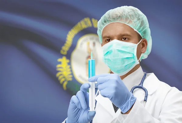 Doctor with syringe in hands and US states flags on background series - Kentucky — Stockfoto