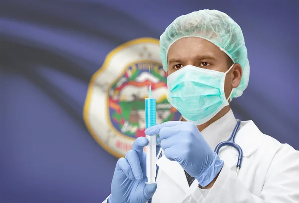 Doctor with syringe in hands and US states flags on background series - Minnesota — Stock fotografie