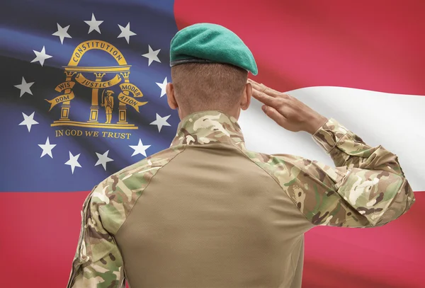 Soldat de peau foncée avec nous d'État drapeau sur fond - Géorgie — Photo