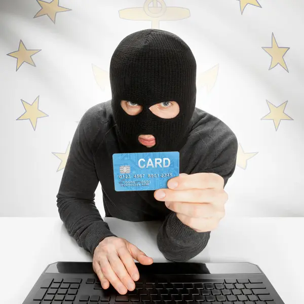 Hacker creditcard met ons bedrijf vlag op achtergrond - Rhode Island — Stockfoto