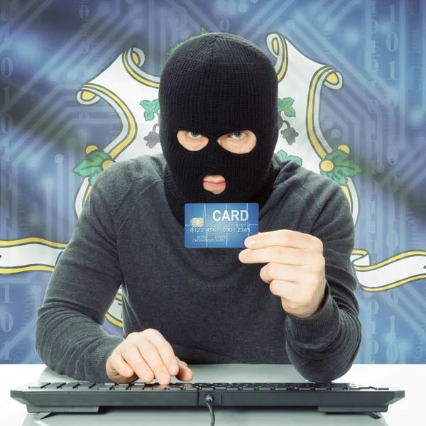 Hacker holding credit card and USA state flag - Connecticut — Stock Photo, Image