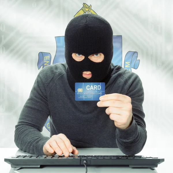 Hacker holding credit card and USA state flag - Massachusetts — Stock Photo, Image