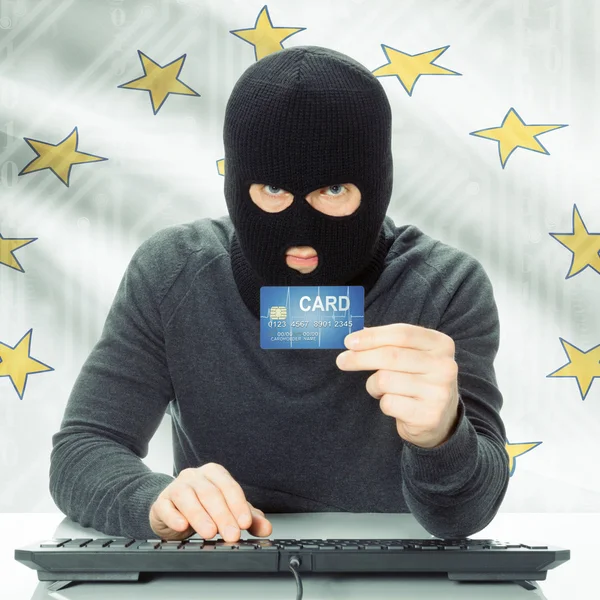 Hacker holding credit card and USA state flag - Rhode Island — Stock Photo, Image