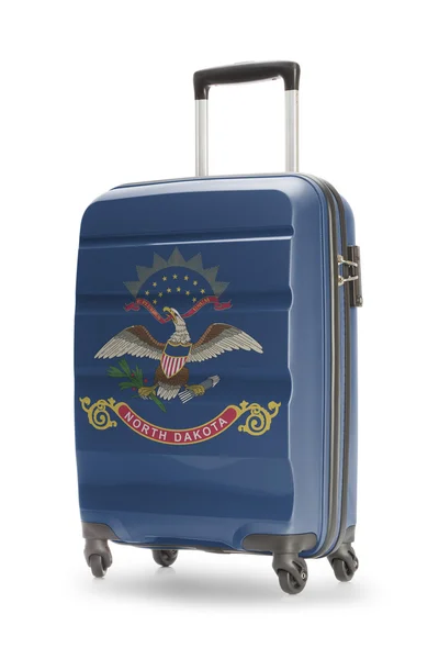 Suitcase with US state flag on it - North Dakota — Stock Photo, Image