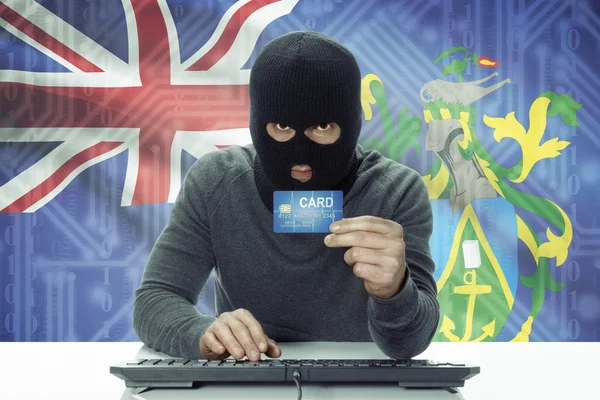 Dark-skinned hacker with flag on background holding credit card - Pitcairn Island —  Fotos de Stock