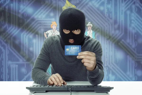 Dark-skinned hacker with USA states flag on background holding credit card - Maine — Stock fotografie