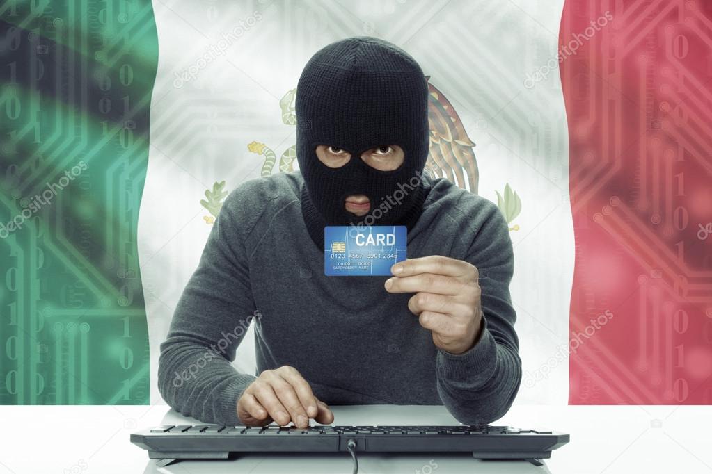Dark-skinned hacker with flag on background holding credit card - Mexico
