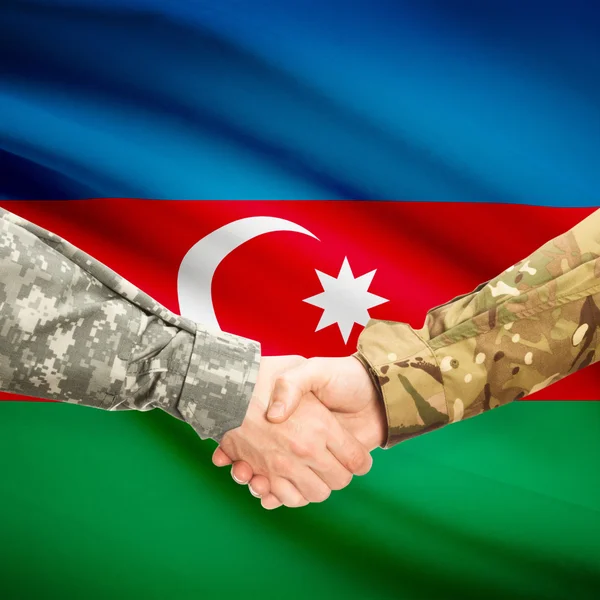 Men in uniform shaking hands with flag on background - Azerbaija — Stock Photo, Image