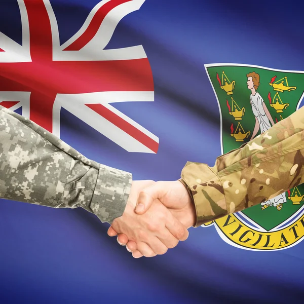 Men in uniform shaking hands with flag on background - British V — Stock Photo, Image