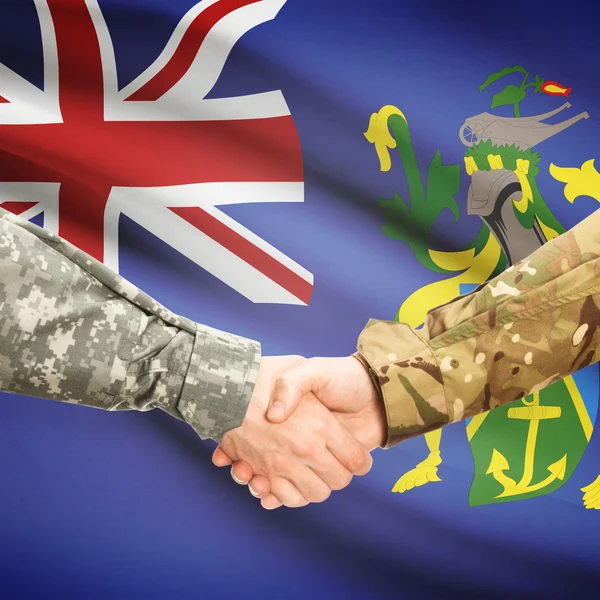 Men in uniform shaking hands with flag on background - Pitcairn — Stock Photo, Image