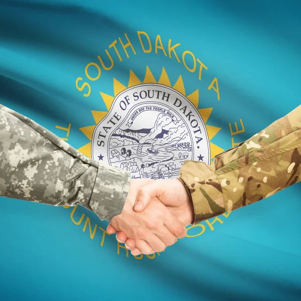 Military handshake and US state flag - South Dakota — Stock Photo, Image