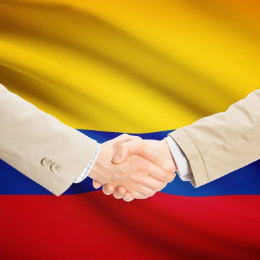 Arka plan - Kolombiya bayrağı ile işadamları el sıkışma