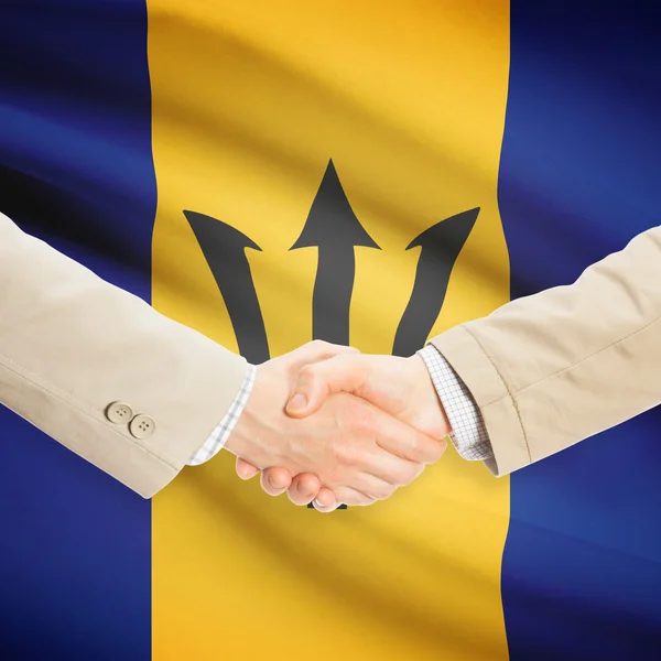 Businessmen handshake with flag on background - Barbados — Stock Photo, Image