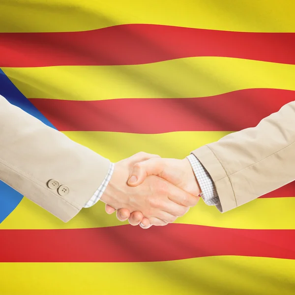 商人握手与背景-Estelada-西班牙国旗 — 图库照片
