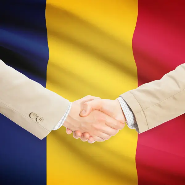 Businessmen handshake with flag on background - Chad — Stock Photo, Image