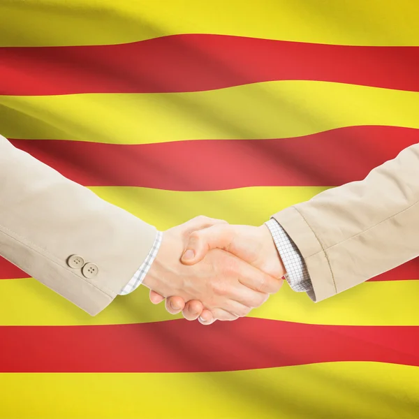 Businessmen handshake with flag on background - Catalonia - Spai — Stock Photo, Image