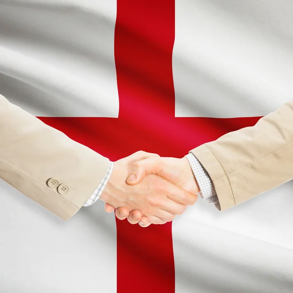 Businessmen handshake with flag on background - England — Stock Photo, Image