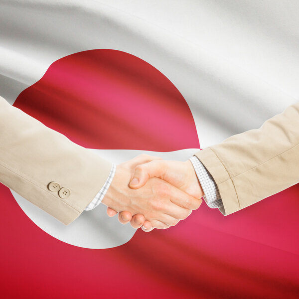 Предприниматели рукопожатие с флагом на фоне - Гренландия