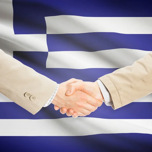 Businessmen handshake with flag on background - Greece — Stock Photo, Image