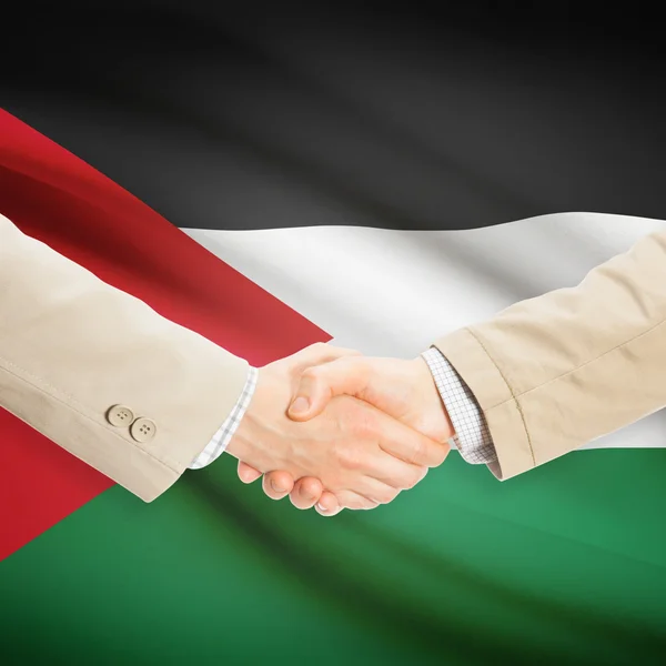 Επιχειρηματίες χειραψία με σημαία σε φόντο - Jordan — Φωτογραφία Αρχείου