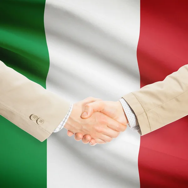 Businessmen handshake with flag on background - Italy — Stock Photo, Image