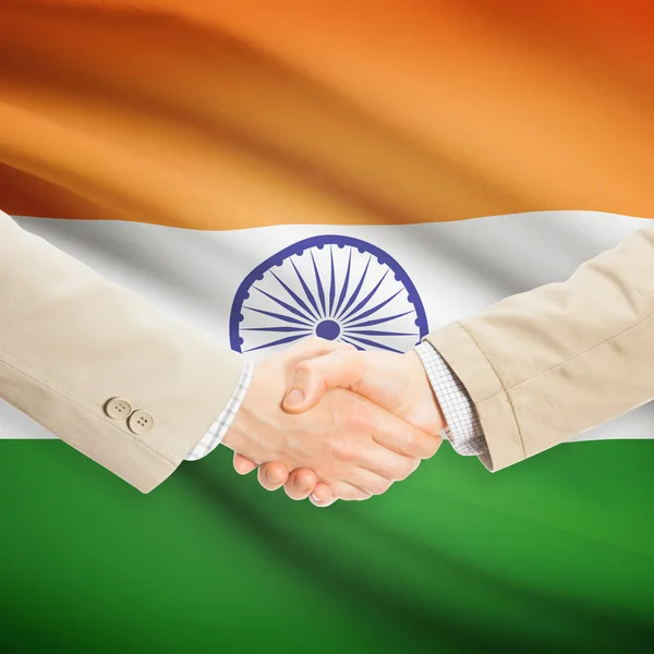 Businessmen handshake with flag on background - India — Stock Photo, Image