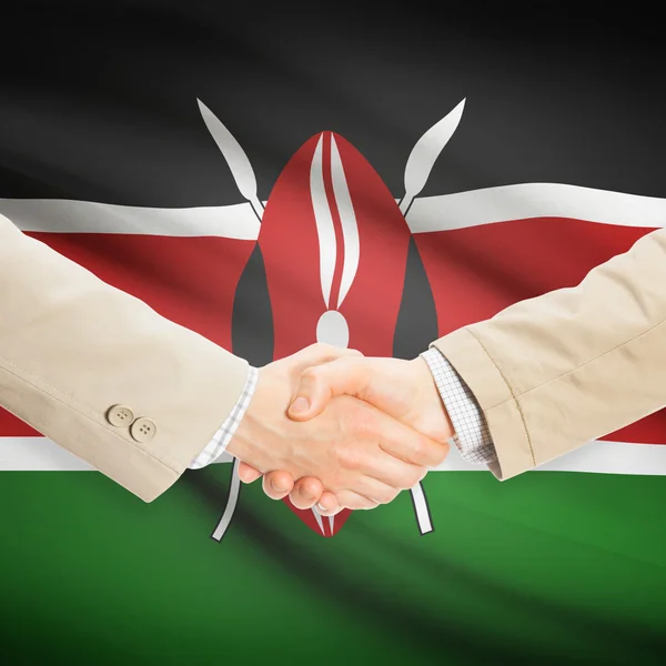 Affärsmän handslag med flagga på bakgrund - Kenya — Stockfoto