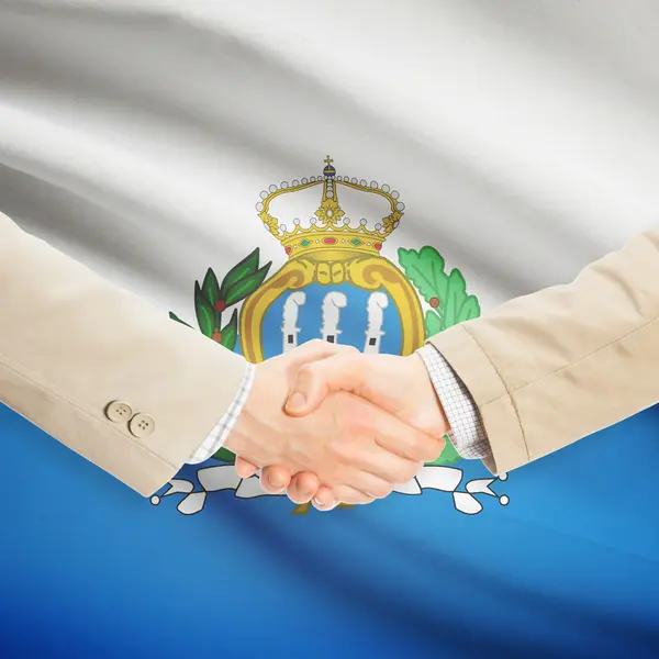 Businessmen handshake with flag on background - San Marino — Stock Photo, Image