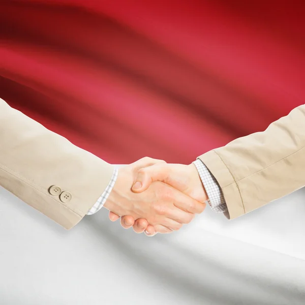 背景 - モナコの旗とビジネスマン握手 — ストック写真